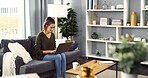 Couch, woman and smile with laptop for freelancer, online information and blog editing for website. Home, female person and content writer with technology for remote work, article research and typing