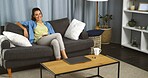 Smile, woman and relax by watching tv at house for peace, movie and subscription service on couch. Happy, female person and chilling with thoughts while streaming film, surfing show and entertainment