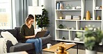 Sofa, woman and laughing with laptop for freelancer, online information and blog editing for website. Home, female person and content writer with digital for remote work, article research and typing