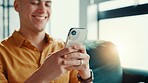 Hands, phone and relax with man on sofa in living room of home for break or internet browsing. App, social media and text message with smile of person in apartment for communication or connection