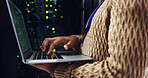 Cybersecurity, hands or person on laptop for engineering, repair or inspection in server room. Information technology, programming or IT technician with data for maintenance, backup or control panel