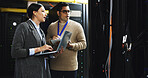 People, laptop and tablet with team in server room for technical support, software update or online maintenance. Talking, collaboration and upgrade with information technology solution in data center