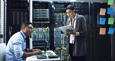 Buy stock photo Woman, tablet and discussion with man in server room, programming and notes for IT solution at company. People, cybersecurity and talk with tech, app and information technology for system maintenance
