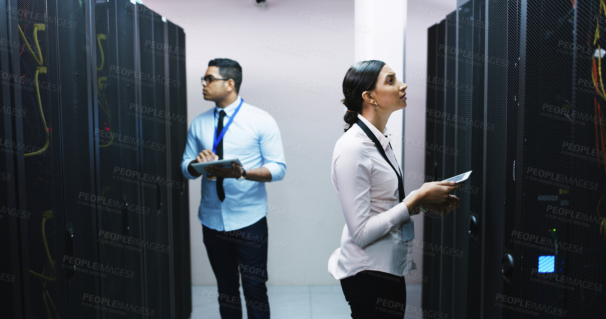 Buy stock photo Man, woman and tablet with team in server room for technical support, software update or online maintenance. Inspection, collaboration and upgrade with information technology solution in data center