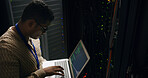 Server room, laptop and technician man for coding, cybersecurity update or online machine system. IT support, data center and back of engineer for network, information technology and service solution