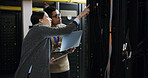 People, laptop and tablet with teamwork in server room for technical support, software update or maintenance. Inspection, upgrade and work together for information technology solution in data center