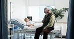 Sick, child and visit of grandfather at hospital for support, medical recovery and post surgery. Smile, patient and senior man for care after operation, healthcare services and healing from procedure