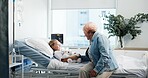Girl, child and hospital bed with grandma for healthcare, prcoedure or operation at clinic. Grandmother, kid and patient with smile, teddy bear or support for comfort, medical treatment or recovery