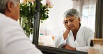 Tired, senior woman and sleeping in bedroom for peace, afternoon nap and dreaming. Fatigue, elderly person and mirror reflection for exhaustion, weekend burnout and asleep at vanity for rest at house