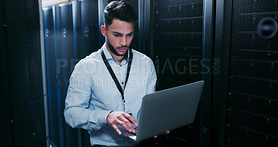Buy stock photo Data center, cybersecurity and man with laptop, typing and  network engineer with tech for software. Server room, IT specialist and person with computer for firmware upgrade, serious and maintenance