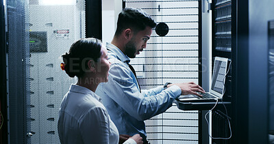 Buy stock photo Data center, team and people with laptop for maintenance, diagnostics or discussion. IT, technician and typing on computer in server room for cybersecurity, system upgrade or planning software update