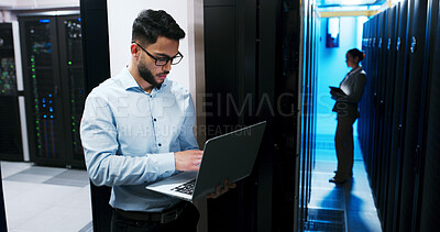 Buy stock photo Data center, cybersecurity and man with laptop, coding and  network engineer with tech for software. Server room, IT specialist and person with computer for firmware upgrade, serious and maintenance