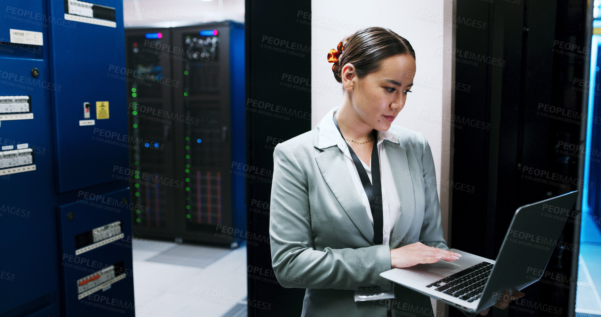 Buy stock photo Laptop, typing and woman in data center for cybersecurity, network maintenance or programming. Administration, computer and firewall installation with IT engineer or professional in server room