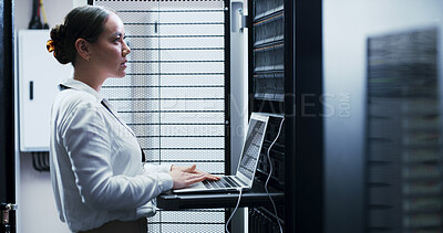 Buy stock photo Laptop, typing and woman in server room for engineering, network maintenance or programming. Administration, computer and cybersecurity with IT professional in data center for firewall installation