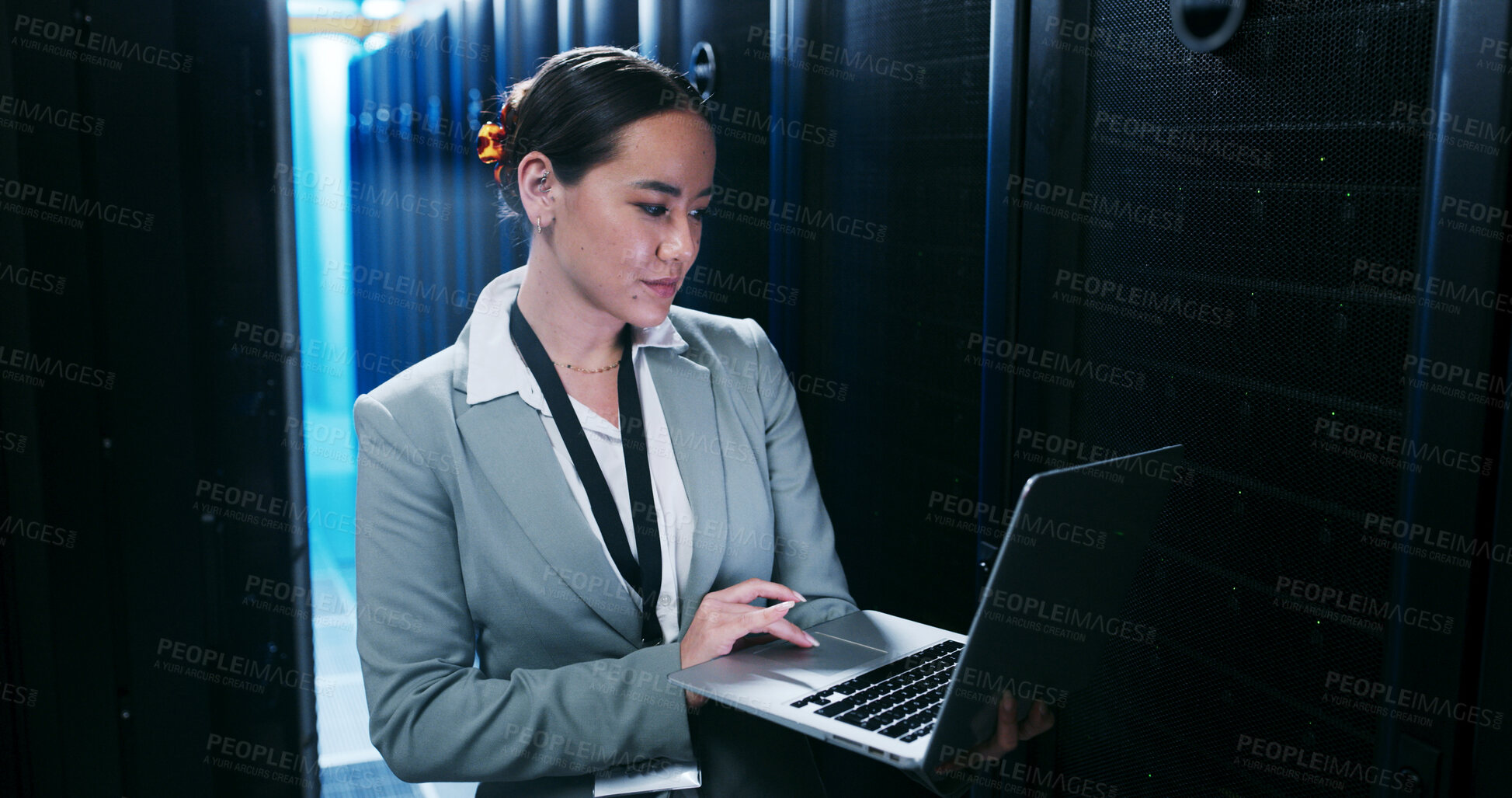 Buy stock photo Engineering, laptop and woman in server room for cybersecurity, network maintenance or programming. Computer, firewall installation and typing with IT professional in data center for administration