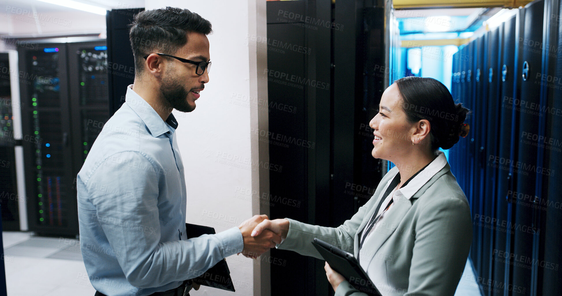 Buy stock photo Administration, handshake and meeting with people in server room together for networking agreement. Data center, deal and partnership with cybersecurity team shaking hands for thank you or welcome