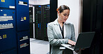 Laptop, typing and woman in server room for administration, network maintenance or programming. Computer, cybersecurity and firewall installation with IT professional in data center for engineering