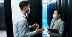 Cybersecurity, discussion and face mask with people in server room for backup, team and technician. Cloud engineer, network hosting and security database with employees for hardware platform