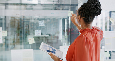 Buy stock photo Business woman, back and tablet with sticky note by glass board for planning, agenda or project schedule for sales. Brainstorming, screen and financial info on tech, strategy ideas and finance firm