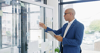 Buy stock photo Businessman, tablet and sticky note for finance, research or brainstorming in office for strategy. Glass wall, employee and technology with report, feedback or schedule tasks for investment project