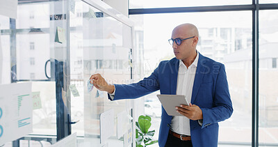 Buy stock photo Businessman, tablet and sticky note for finance, planning or brainstorming in office for strategy. Glass wall, employee and technology with research, report or schedule tasks for investment project