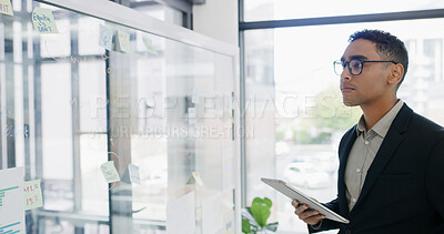 Buy stock photo Businessman, tablet and glass wall for finance, review or brainstorming in office for strategy. Thinking, employee and technology with sticky note, feedback or schedule tasks for investment project