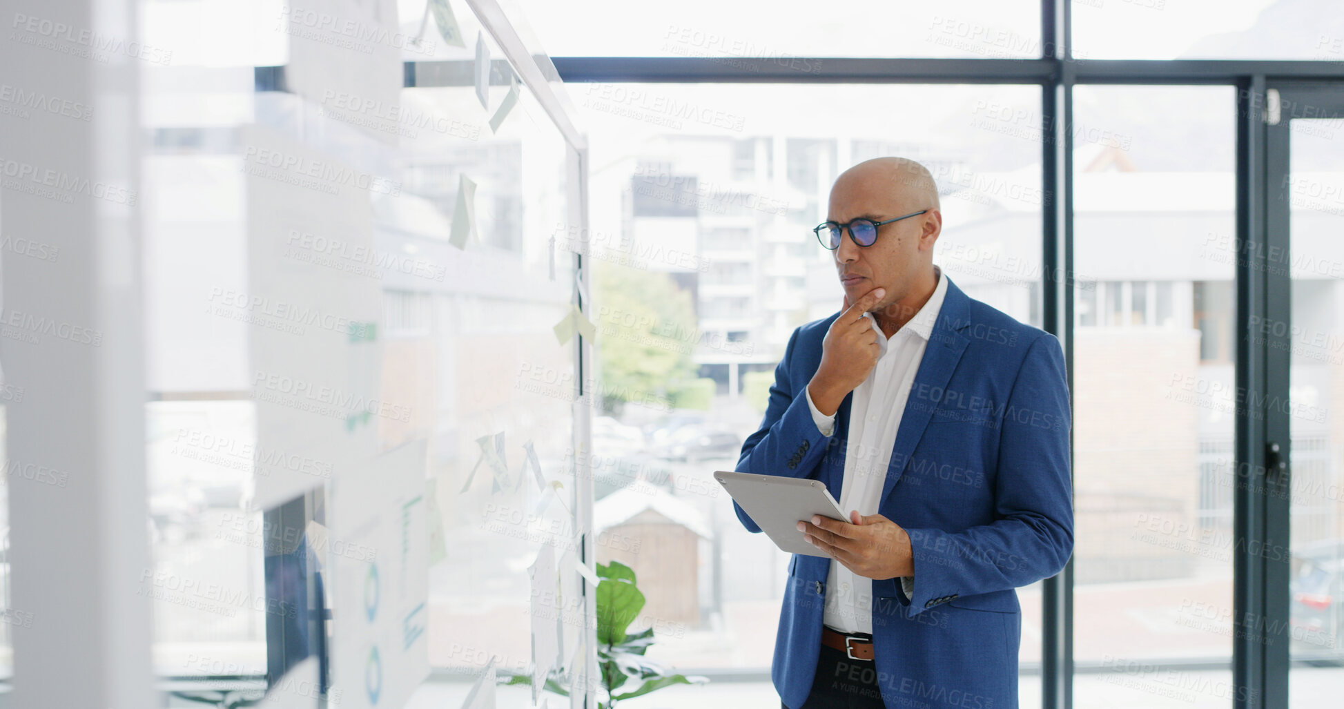 Buy stock photo Businessman, tablet and thinking for finance, glass wall or brainstorming in office for strategy. Planning, employee and technology with sticky note, research or schedule tasks for investment project