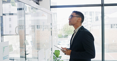 Buy stock photo Businessman, tablet and glass wall for finance, agenda or brainstorming in office for strategy. Thinking, employee and technology with sticky note, planning or schedule tasks for investment project