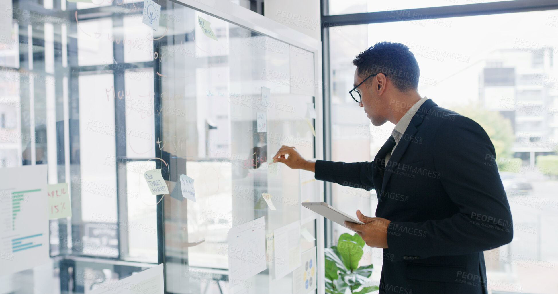 Buy stock photo Businessman, tablet and sticky note for finance, research or brainstorming in office for strategy. Glass wall, employee and technology with budget, planning or schedule tasks for investment project