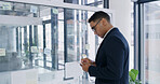 Businessman, tablet and thinking for finance, review or brainstorming in office for strategy. Glass wall, employee and technology with sticky note, feedback or schedule tasks for investment project