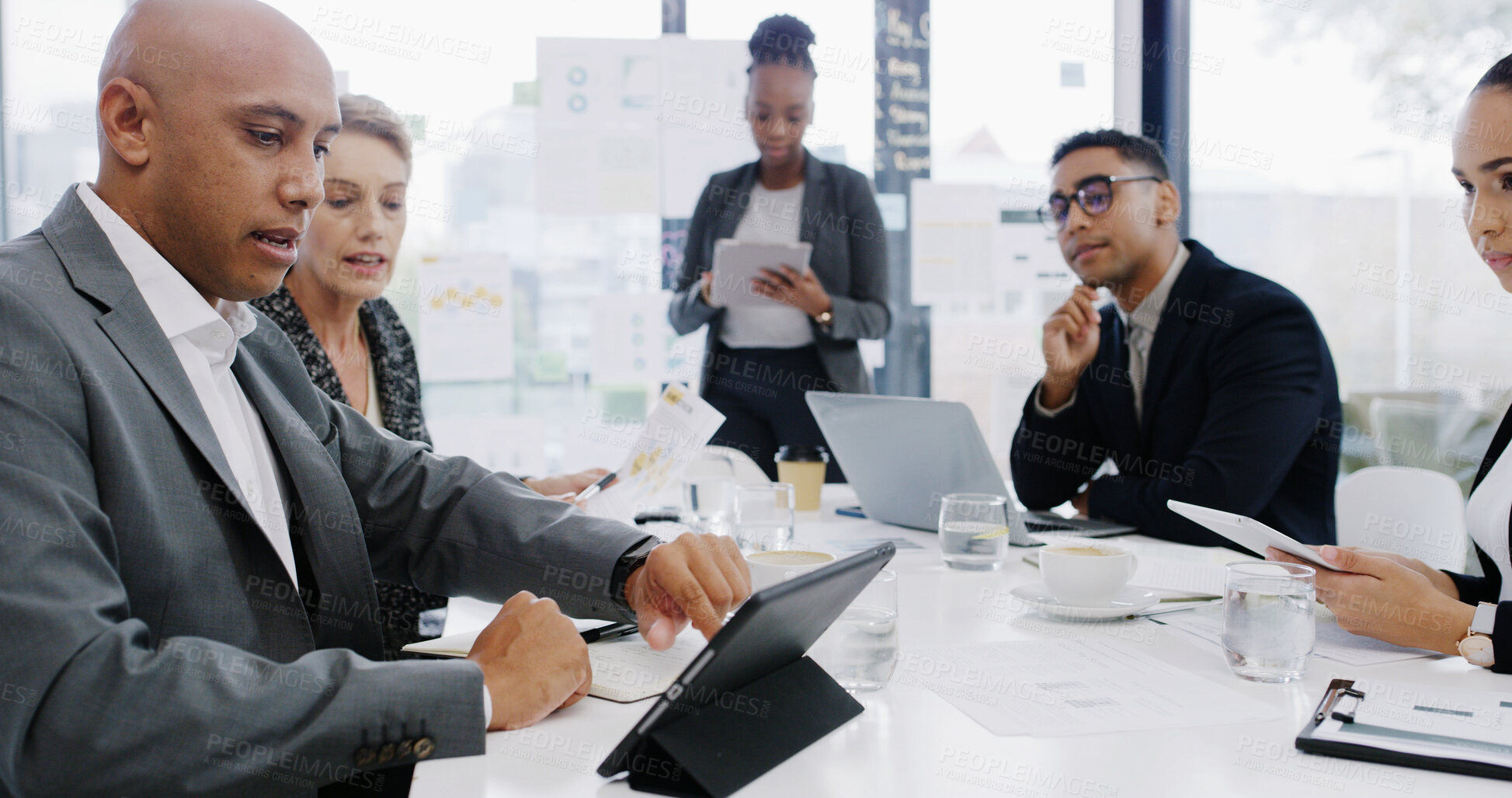 Buy stock photo Tablet, planning and teamwork with business people in meeting for revenue, profit report and research. Budget proposal, investment portfolio and feedback with employees in office for project