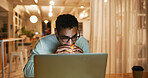 Man, eating and night with laptop at house for research, proofreading article and multitasking. Journalist, food and pc for reading story, check facts and review information for publication deadline