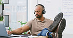 Business man, laptop and music for task, break or finished with podcast or video. Headphones, consultant and creative agent with audio, streaming and rest for project management idea or thinking