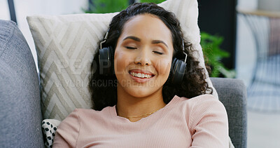 Buy stock photo Headphones, relax and woman on sofa, wellness and listening to music, home and meditation. Apartment, sound and person on couch, streaming audio and mental health with radio, zen and calm in lounge