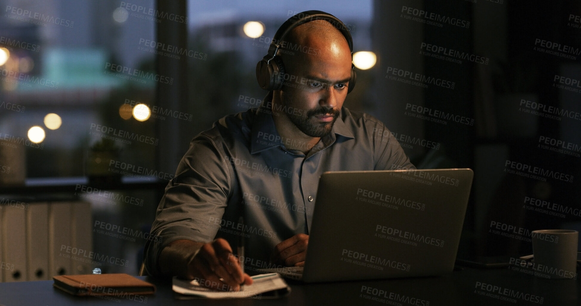 Buy stock photo Man, laptop and night with feedback, video and notes for project management deadline in office. Bokeh, editor and computer with reading, research or review process with overtime at creative agency