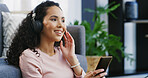 Happy woman, headphones and listening with phone to music for audio streaming or sound in home. Female person, relax or smile with mobile smartphone for playlist, podcast app or subscription in house