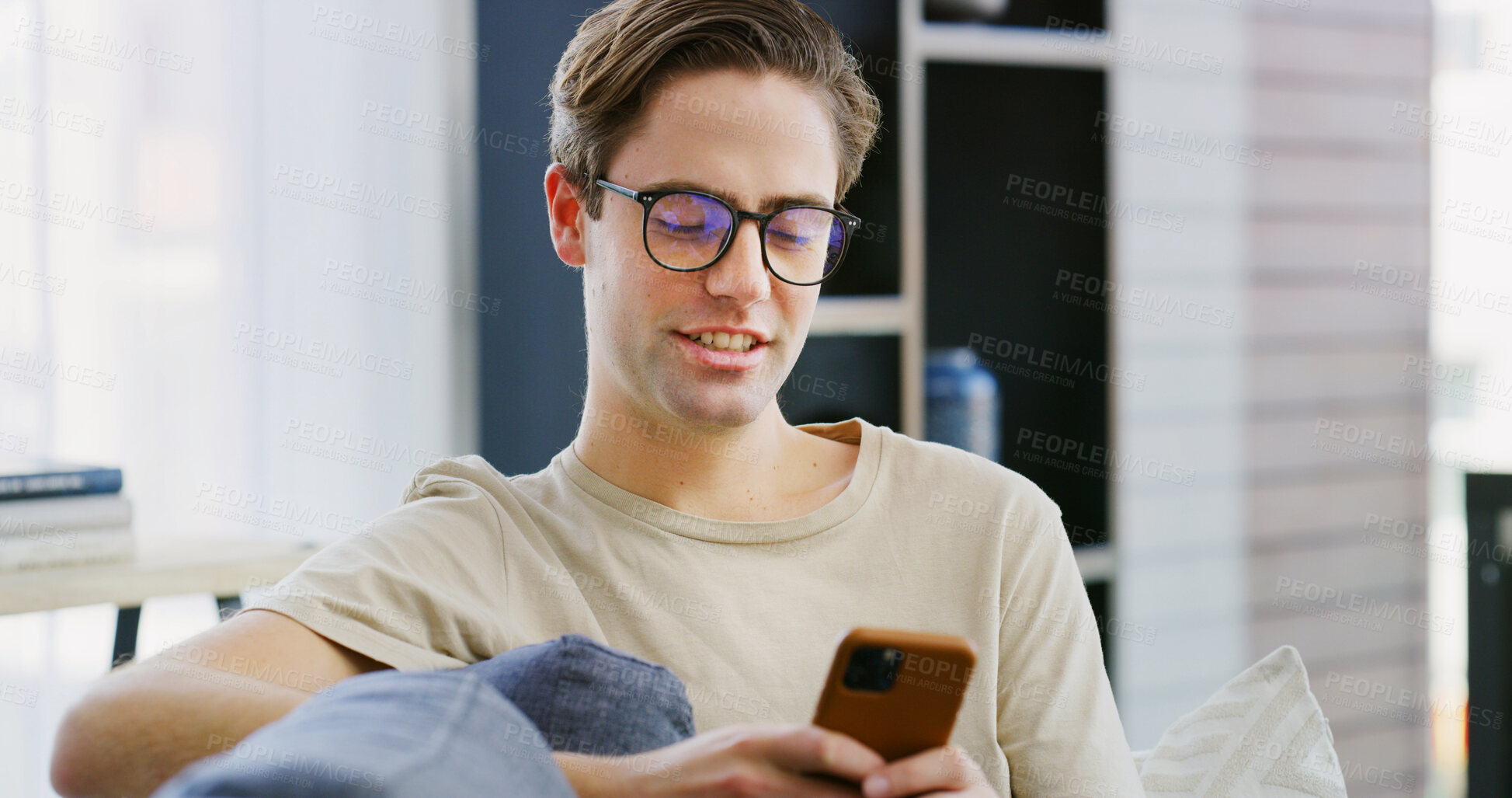 Buy stock photo Home, relax and man on sofa, smartphone and typing with social media, texting and message to contact. Apartment, mobile user and person on couch, cellphone and internet with communication and email