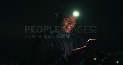 Buy stock photo Headlamp, hiking and phone with black man at night to search for directions to destination or location. App, map and navigation with happy hiker outdoor for evening adventure or journey in dark