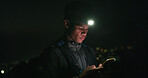 Headlamp, hiking and phone with black man in dark to search for directions to destination or location. App, map and night with hiker outdoor for evening adventure, journey navigation or travel