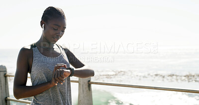 Buy stock photo Black woman, fitness and beach with smart watch for performance, step counter or pulse in nature. Active, female person or runner checking wristwatch for workout schedule or heart rate on promenade