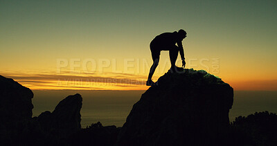 Buy stock photo Mountain climbing, silhouette and sunset with person at summit for adventure or journey. Fitness, sky space and travel with hiker outdoor on peak in nature for exercise, evening hobby or health