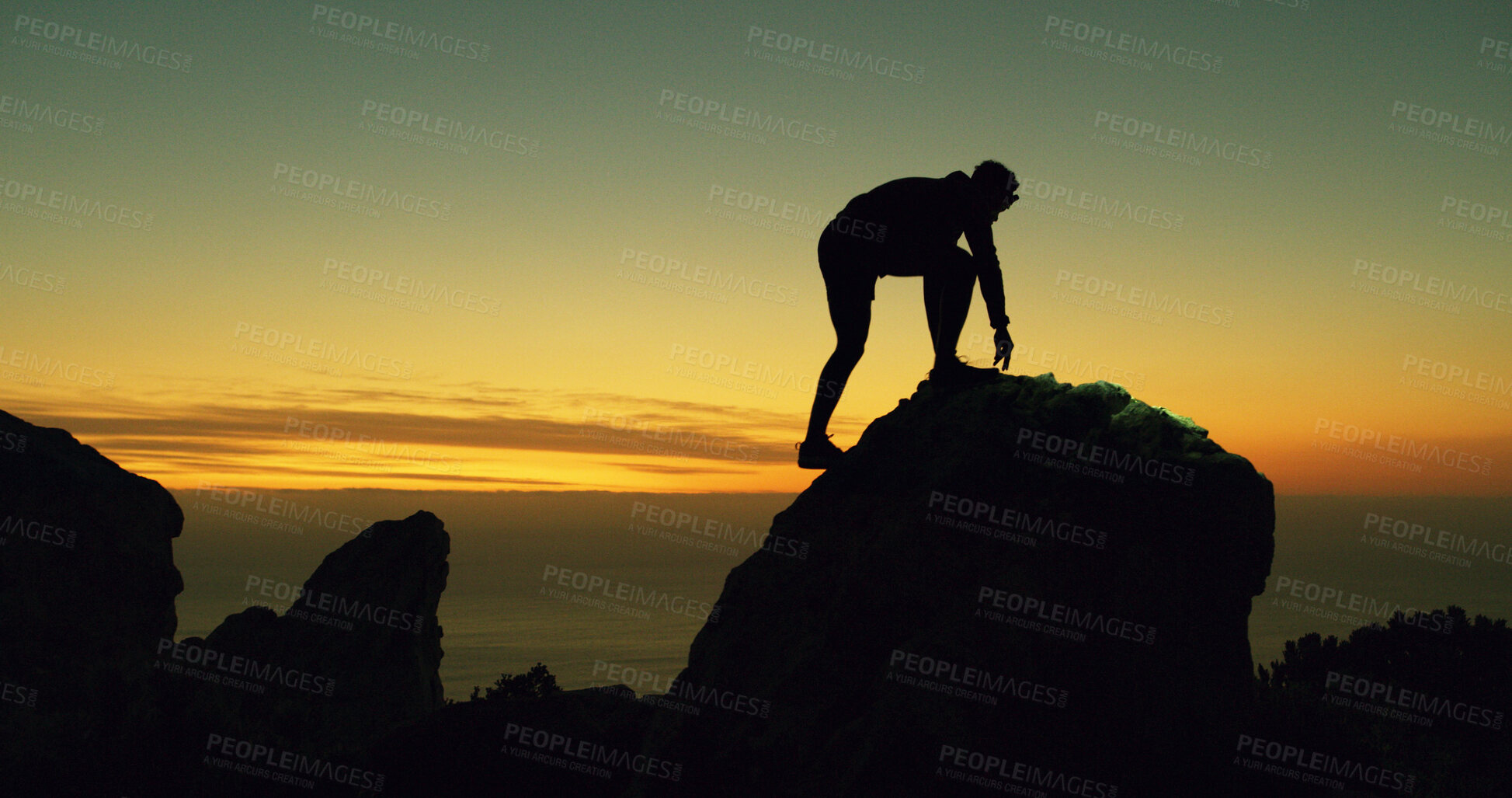 Buy stock photo Mountain climbing, silhouette and sunset with person at summit for adventure or journey. Fitness, sky space and travel with hiker outdoor on peak in nature for exercise, evening hobby or health