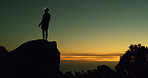 Night, rock climber and break in nature, adventure and person on cliff with headlamp and silhouette. Outdoor, space and athlete on mountain for fitness, sunset and light for exploration in dark