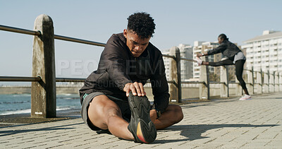 Buy stock photo Man, fitness and stretching with leg for workout preparation or flexibility on promenade. Active, male person or runner with body warm up or foot for health, physical exercise or outdoor training