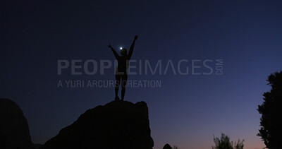 Buy stock photo Person, silhouette and night with celebration on mountain for conquer, achievement or milestone. Active, hiker and winning in late evening for workout goal or accomplishment on rock, cliff or space