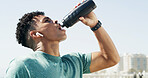 Drinking water, outdoor and man with workout hydration and break with wellness, exercise and fitness. Healthy person, thirsty and runner with mineral drink, liquid and morning with rest and training