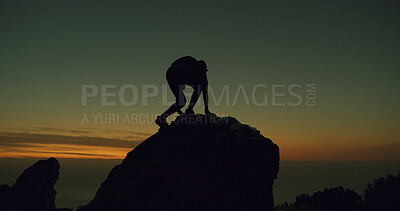 Buy stock photo Mountain climbing, silhouette and sunset with hiker at summit for adventure or journey. Fitness, sky space and travel with person outdoor on peak in nature for exercise, evening hobby or health