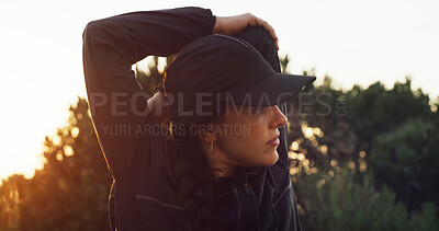 Buy stock photo Woman, fitness and stretching with sunset in nature for workout preparation or outdoor exercise. Active, female person or hiker with arm warm up for physical activity, hiking or trekking in forest