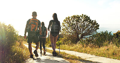 Buy stock photo Friends, people and hiking in nature with back view for travel, holiday or group walk on vacation. Man, women and outdoor with trekking pole for adventure, expedition or explore path on journey