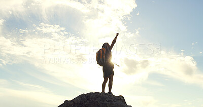 Buy stock photo Person, celebration and hiking on mountain, sky and fist pump for success, clouds and milestone in summer. Adventure, trekking and goals on trail, summit and outdoor with achievement in nature space